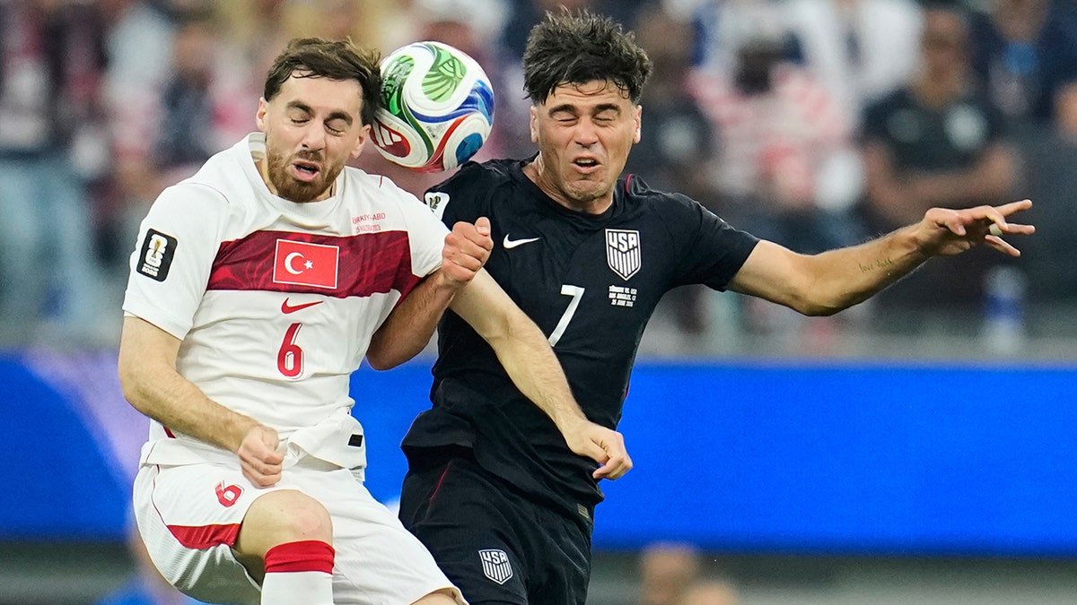 Gio Reyna and Orkun Kokcu battle for ball
