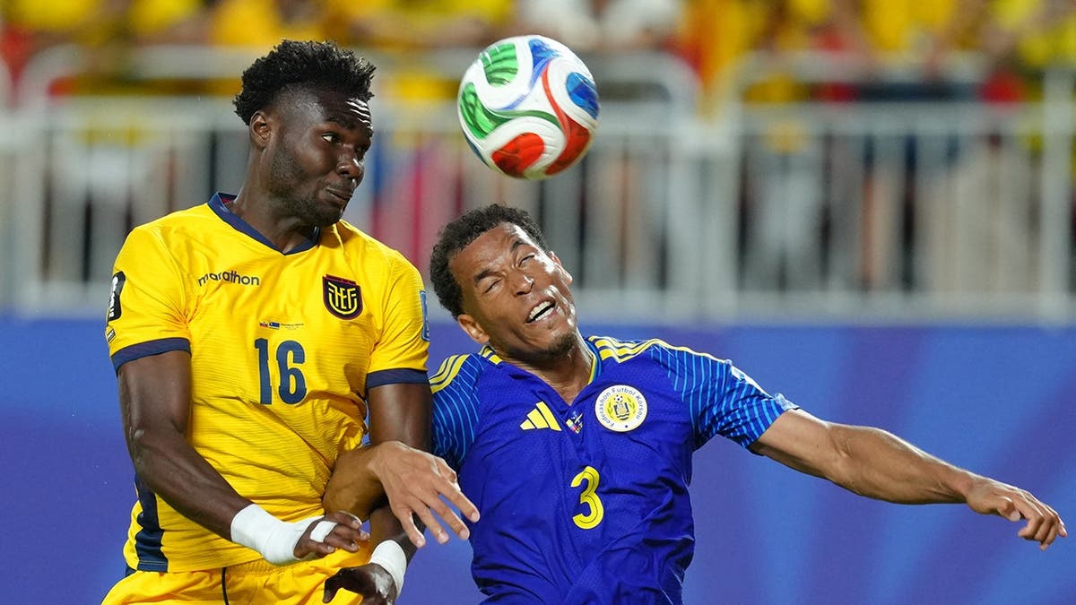 Ecuador's Jordy Caicedo and Curaçao's Jurien Gaari jumping for a header during a soccer match.