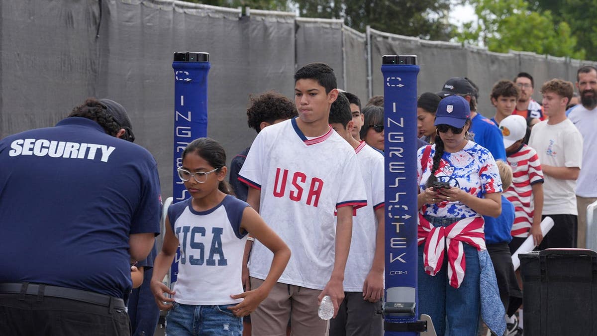 United States fans passing through security checks at training venue in Irvine, California