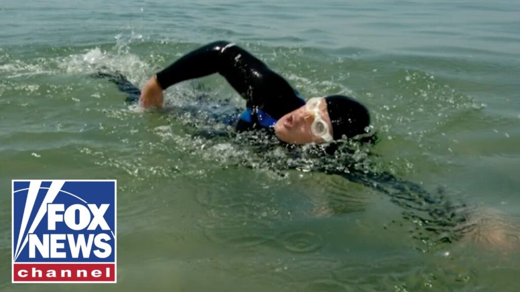 SWIMMING FOR AMERICA’S HEROES: Towing 250 cannonballs across Lake Michigan