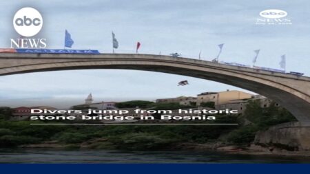 Divers plunge from historic stone bridge in Bosnia Divers plunge from historic stone bridge in Bosnia
