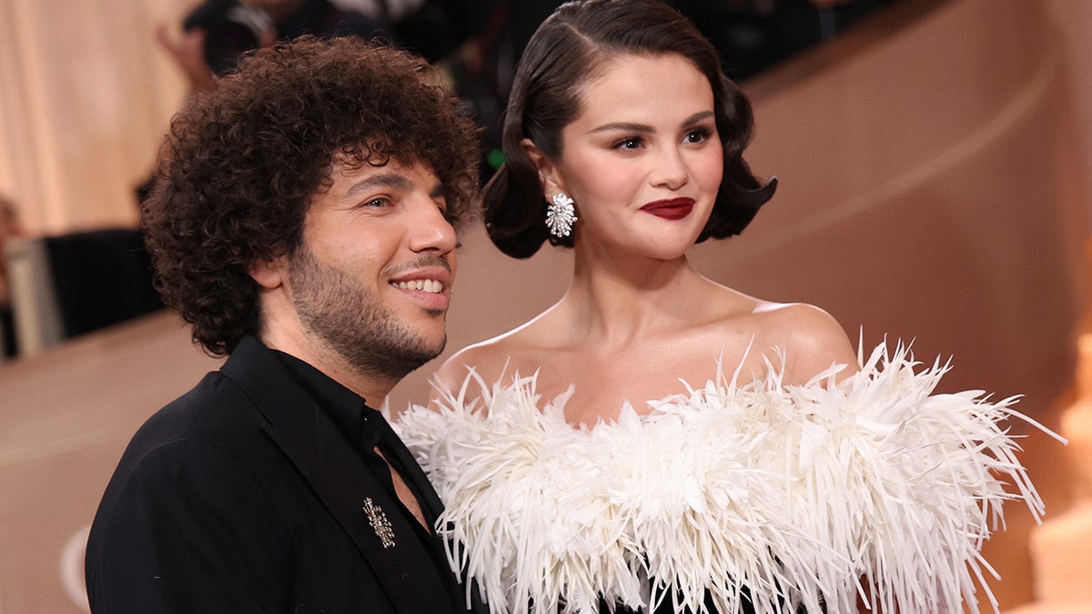 Selena Gomez and Benny Blanco standing together at their wedding event