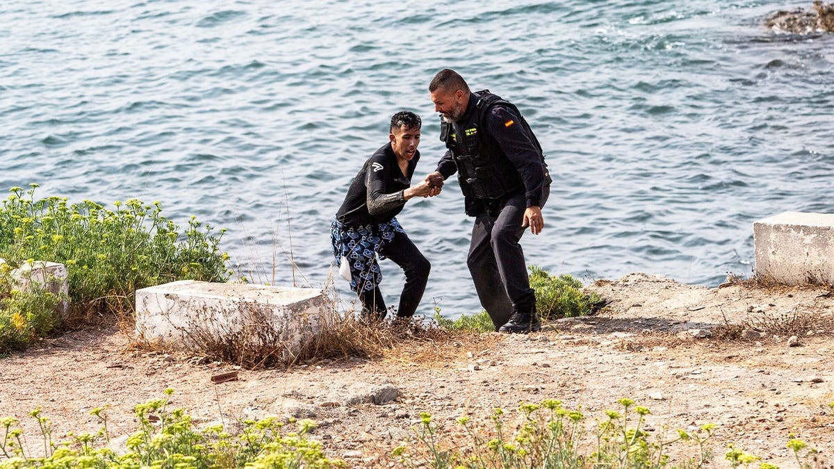 Spanish and Moroccan maritime patrols, supported by Spain's Maritime Rescue service, conduct rescue operations off the southern coast of Ceuta after a sharp increase in migrant arrivals to the Spanish enclave in North Africa. Nearly 2,000 migrants have reached Ceuta over the past two weeks, most by swimming around the Tarajal breakwater separating Spain from Morocco. The arrivals include hundreds of unaccompanied minors, prompting local authorities to warn that child protection facilities have been overwhelmed as rescue and border surveillance operations continue.