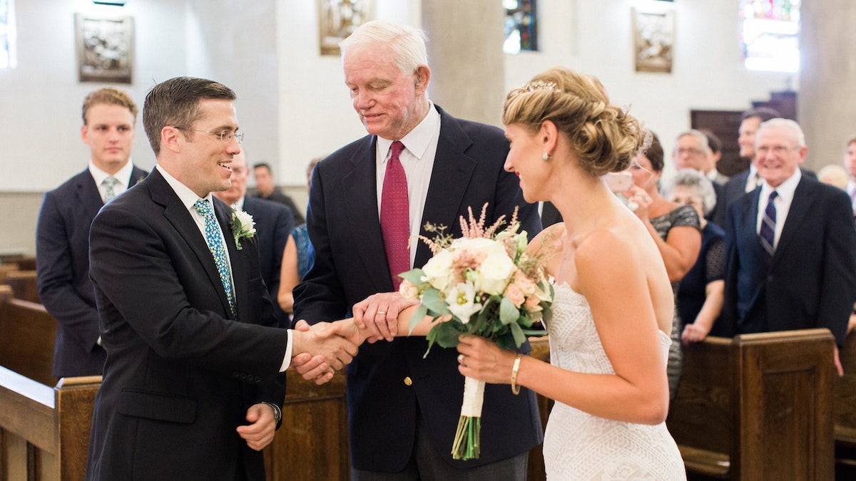 Bride and groom holding hands