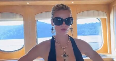 Brooks Nader Narrowly Avoids Wardrobe Malfunction While Going Braless in Plunging Dress on a Yacht