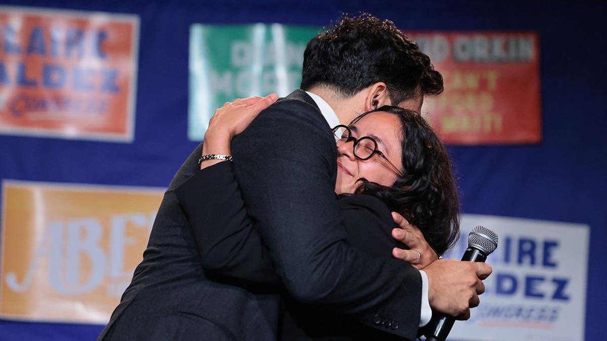 Zohran Mamdani and Claire Valdez hug