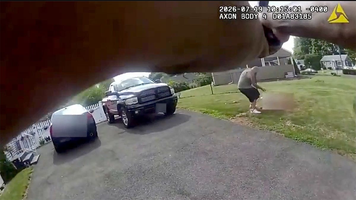 Body camera images show a Meriden police officer pointing his firearm toward a man holding a baseball bat as the suspect stands over a victim lying on the ground during a deadly domestic violence incident in Connecticut.