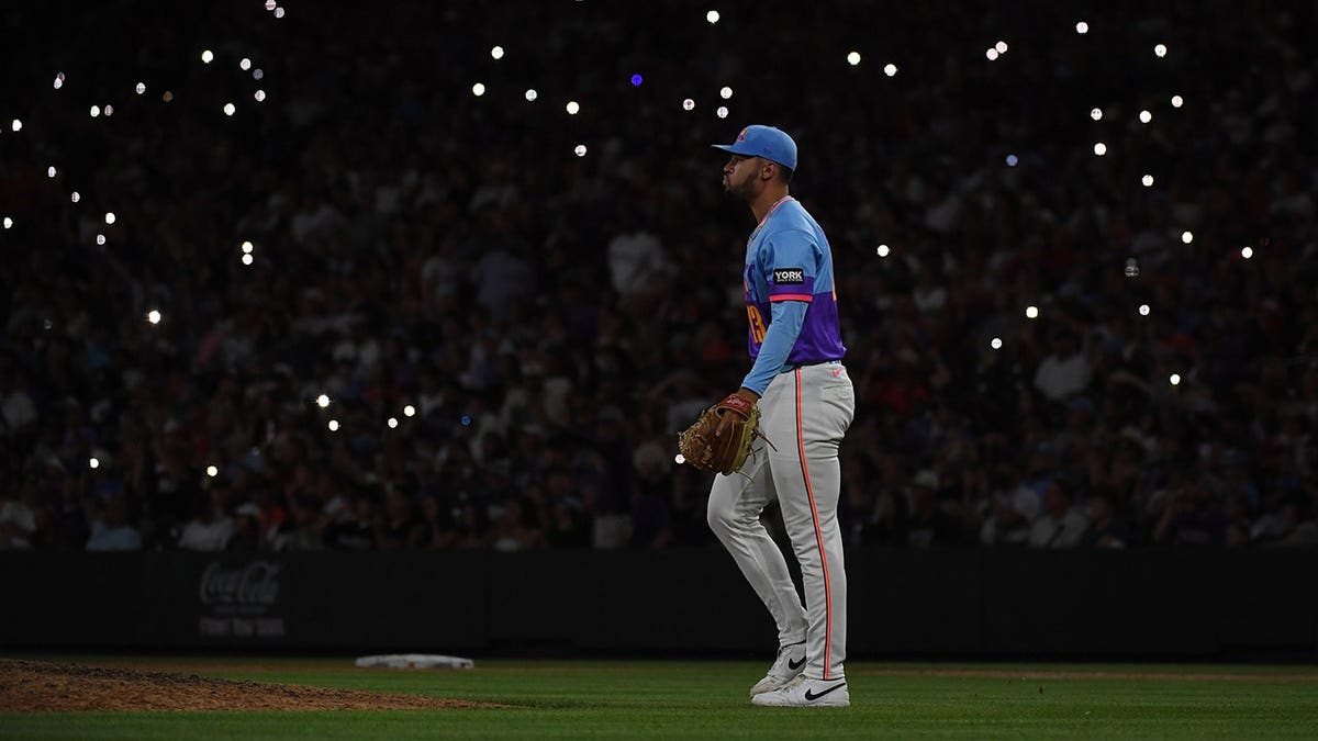Gabriel Hughes pitches on the mound at Coors Field.