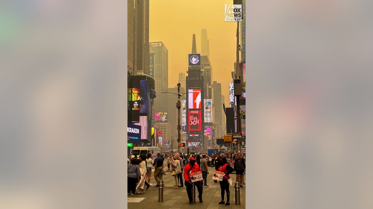Smoke from Canadian wildfires loom over New York City's Times Square on Wednesday, June 7, 2023.