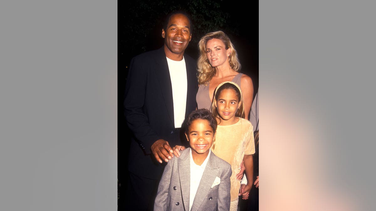 O.J. Simpson and Nicole Brown Simpson stand with children at a premiere in Hollywood.
