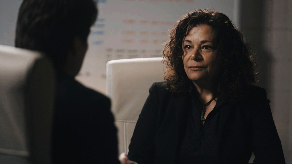 Ninette Toosbuy speaking to someone about the Scott Peterson case.