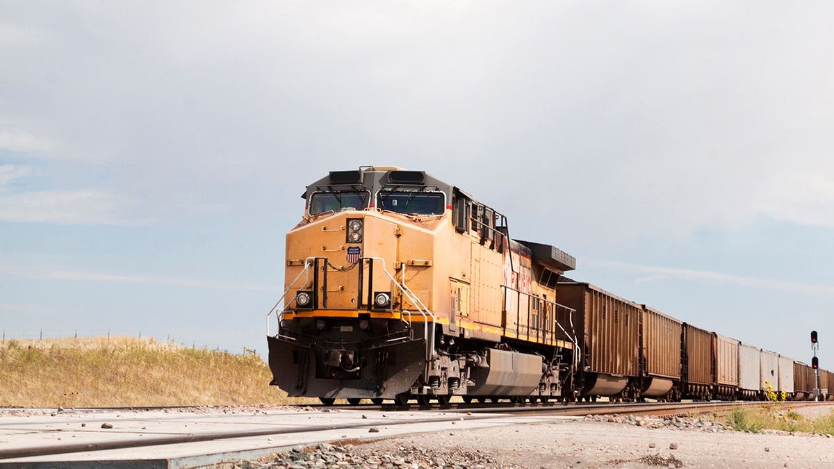 Union Pacific Railroad train approaches on tracks.