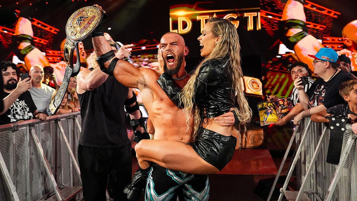 Austin Theory and Maxxine Dupri celebrate together during Monday Night RAW at Allstate Arena in Chicago.