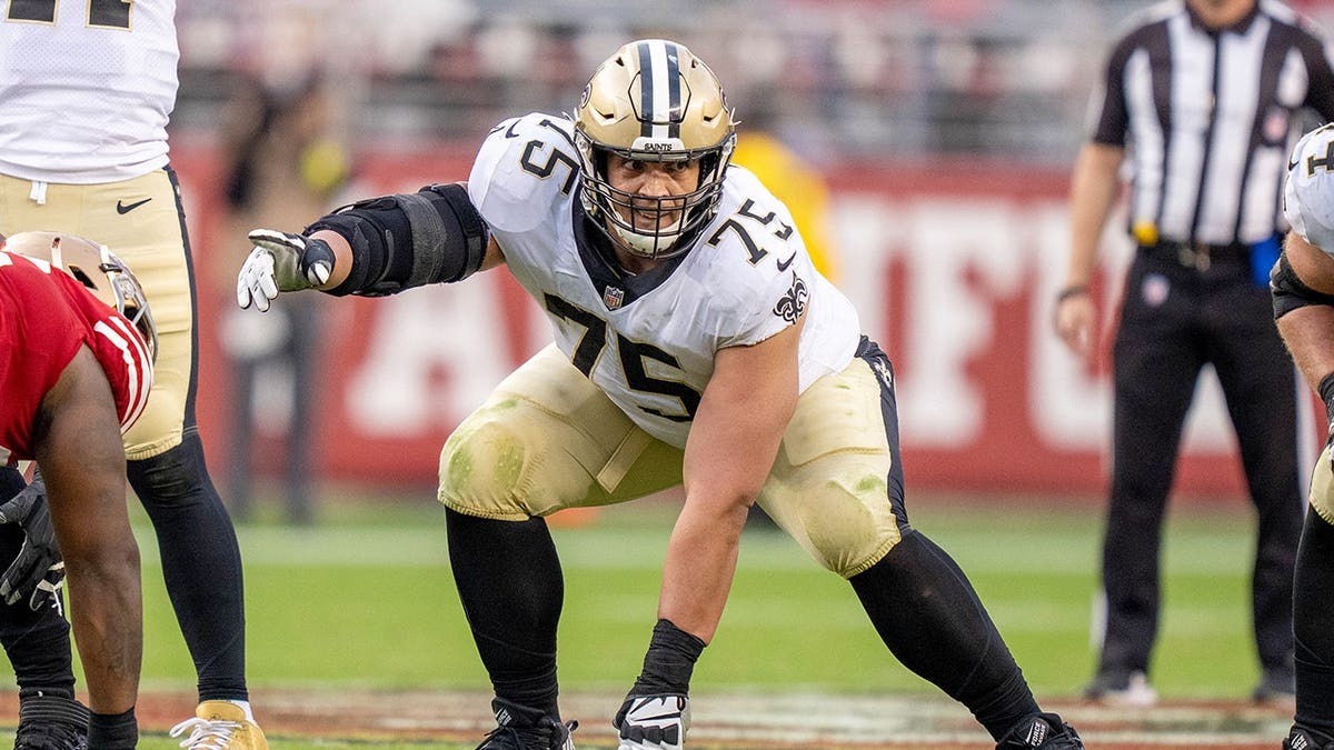 Andrus Peat stands on the field during a game at Levi's Stadium.