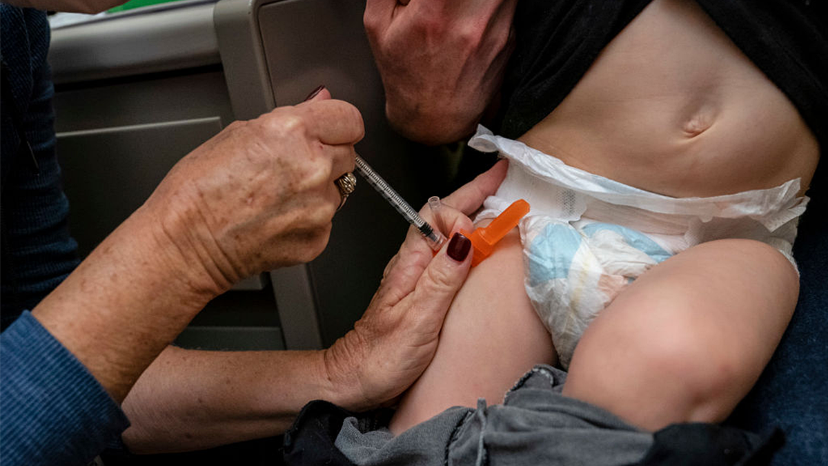 Baby receiving vaccine