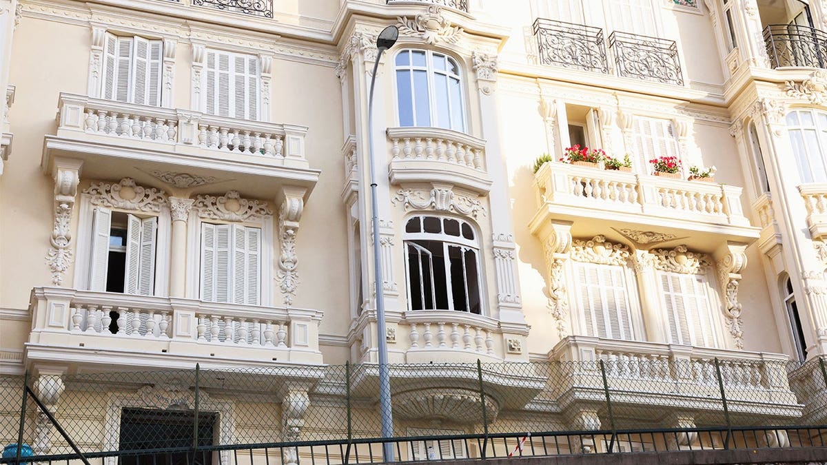 The damaged entrance of a residential building following an explosion on Monday, in Monaco, June 30, 2026.