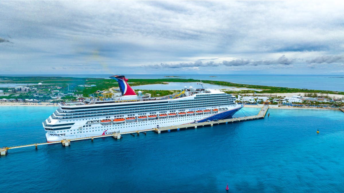 Carnival Sunrise cruise ship sits in water near Grand Turk.