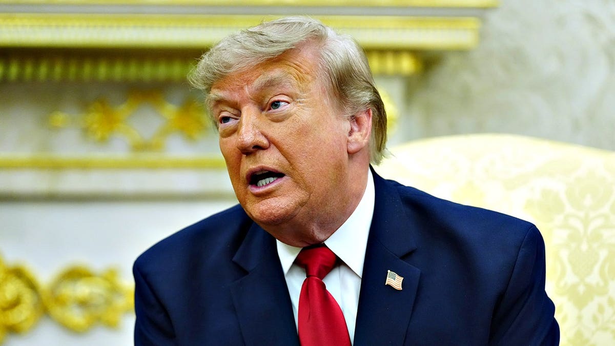 President Donald Trump speaks during a meeting in the Oval Office.