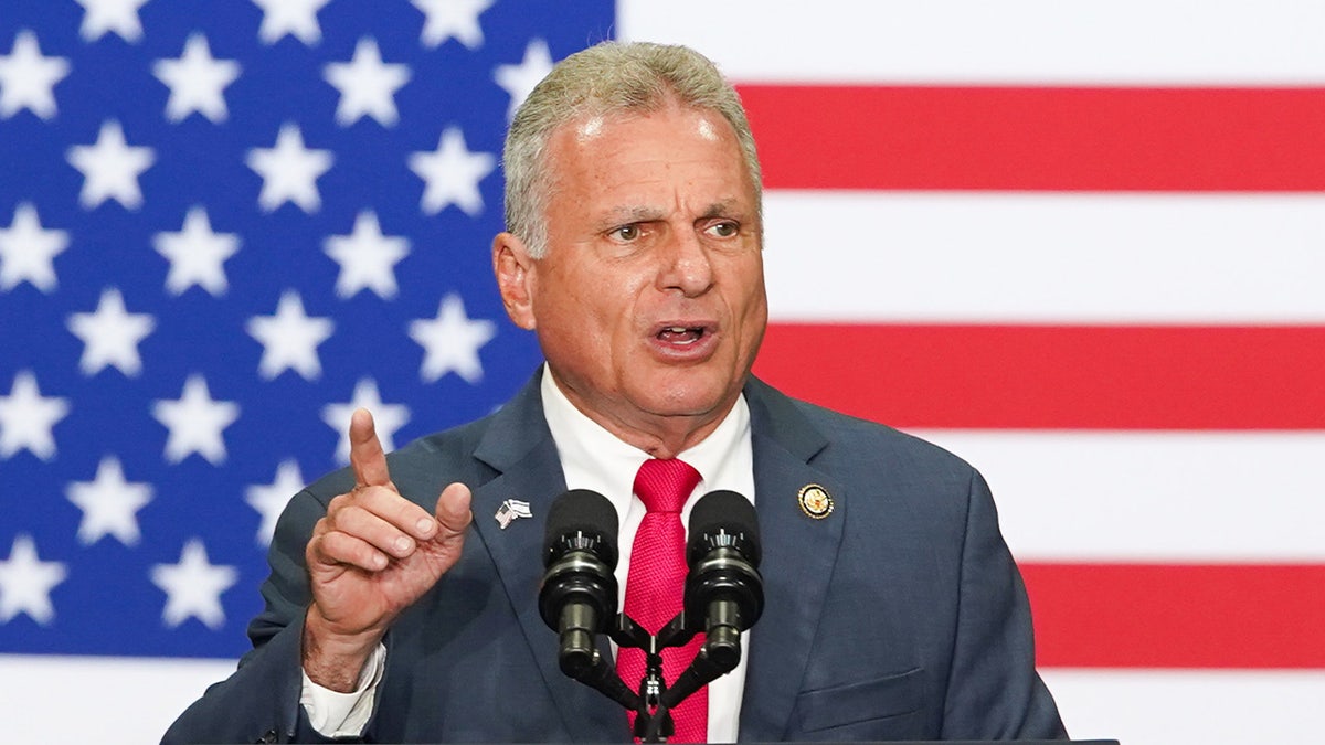Georgia Rep. Buddy Carter speaking in front of an American flag