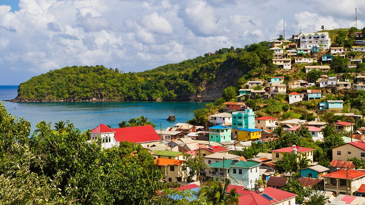 Colorful houses overlook a quiet bay in Canaries fishing village.