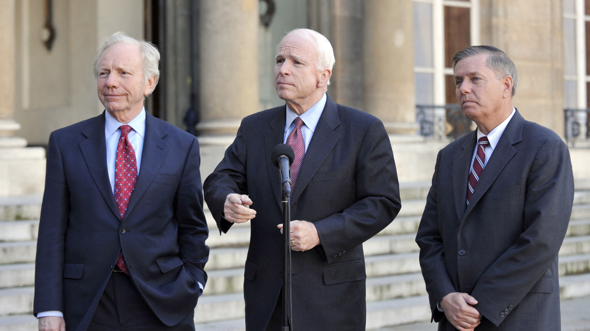 US. Senator Joe Lieberman (L), Republican presidential candidate Senator John McCain (C) and Republican Senator Graham Lindsey speak to the press after a meeting with France's President Nicolas Sarkozy at the Elysee Palace in Paris on March 21, 2008.