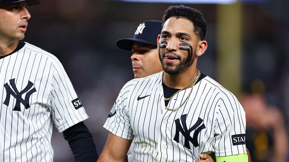Jose Caballero walks off the field at Yankee Stadium during a game.