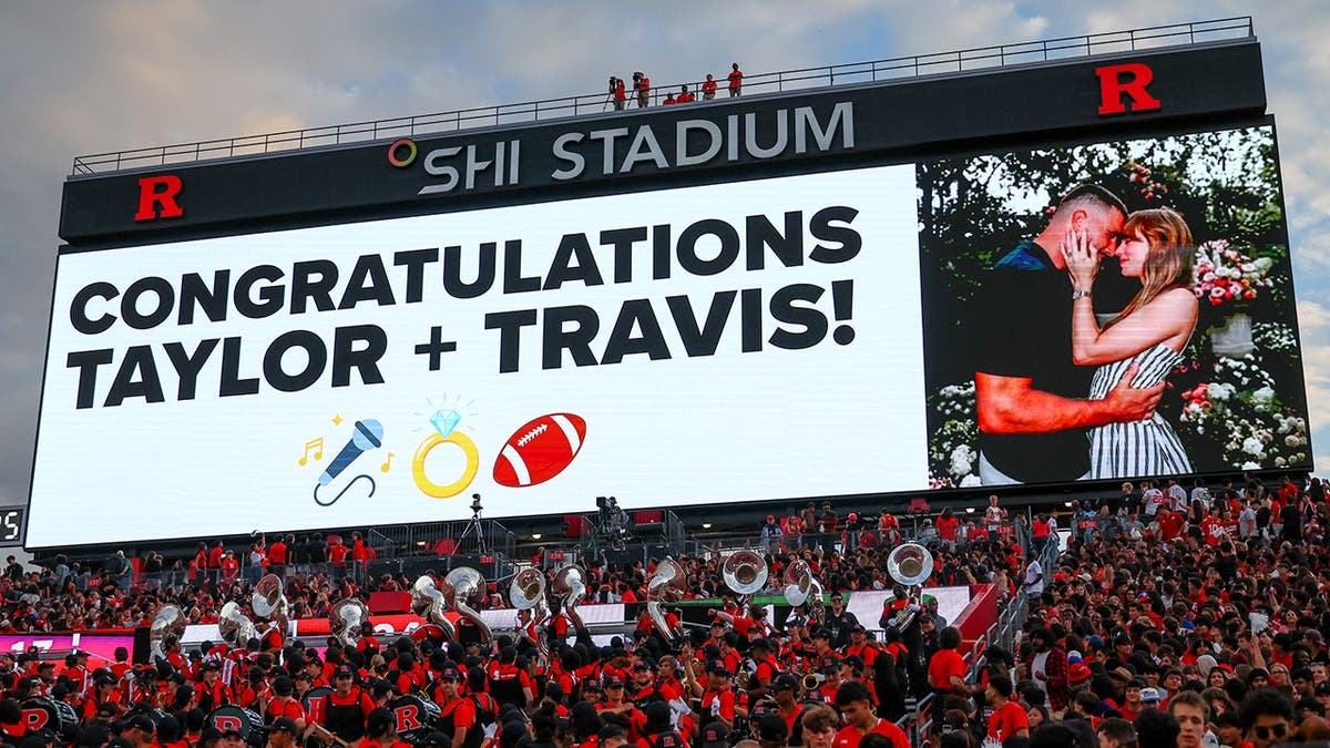 A billboard congratulating Travis Kelce and Taylor Swift on their engagement.