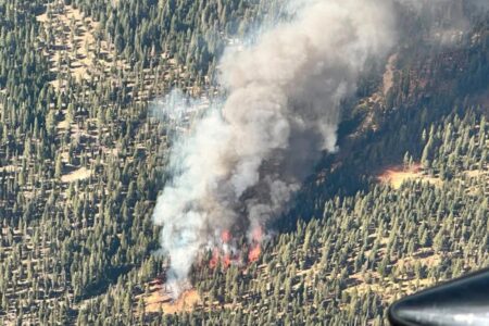Rich homeowners put on notice as wildfire rips through forest near their sprawling Lake Tahoe cabins