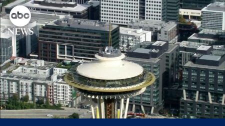 Daredevils scale and jump from Space Needle in Seattle