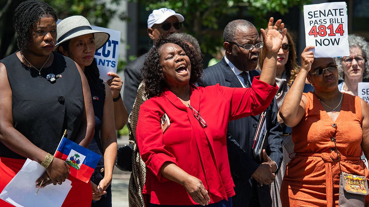 Local Haitian leaders attend a rally calling on Congress to restore Temporary Protected Status (TPS) for Haitians, in Boston, Massachusetts, on July 23, 2026. The US Supreme Court on June 25, 2026, backed a Trump administration move to strip deportation protections from some 350,000 Haitians and 6,000 Syrians living in the United States. A federal appeals court on has extended the deadline for TPS to be revoked for Haitians in the US until July 27. (Photo by JOSEPH PREZIOSO / AFP via Getty Images)