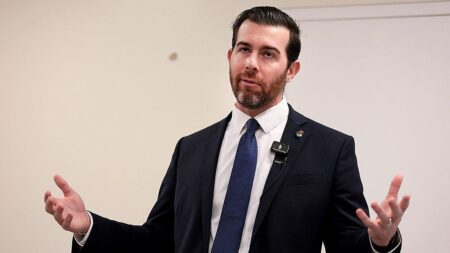 Socialist in Trump country gives Karl Marx vision thumbs-up before ducking key tax question