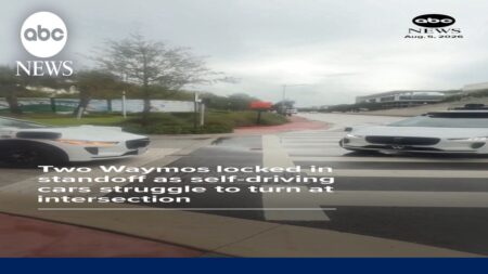 Waymos locked in standoff after self-driving cars struggle to turn at intersection Waymos locked in standoff after self-driving cars struggle to turn at intersection