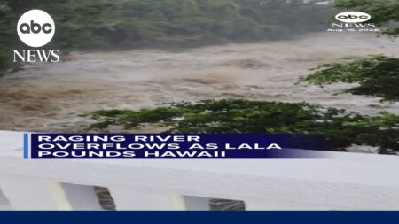 Raging river overflows as Lala pounds Hawaii