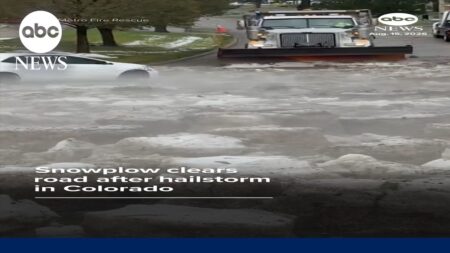 Snowplow clears road after hailstorm in Colorado Snowplow clears road after hailstorm in Colorado