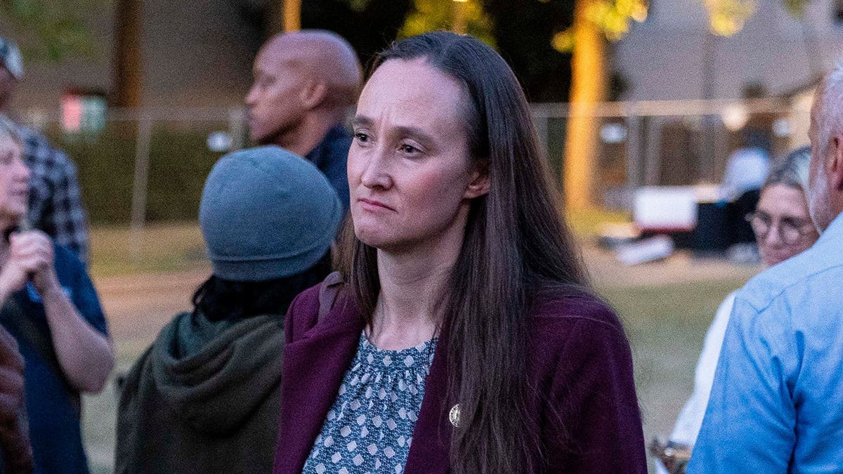 Seattle Mayor Katie Wilson listens to an attendee at a vigil.