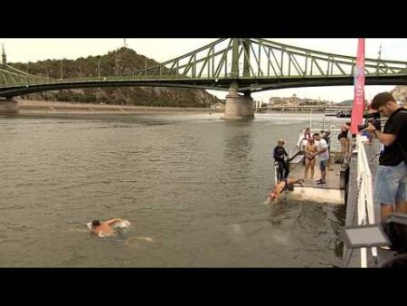 Nearly one thousand people swim across Danube in Budapest for first crossing in six years Nearly one thousand people swim across Danube in Budapest for first crossing in six years