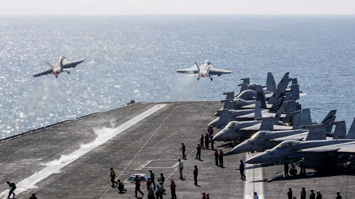 Two F/A-18 Super Hornets take off