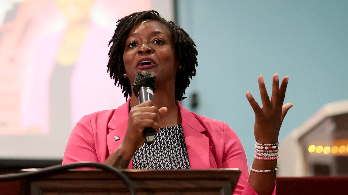 Angie Nixon speaks at a church