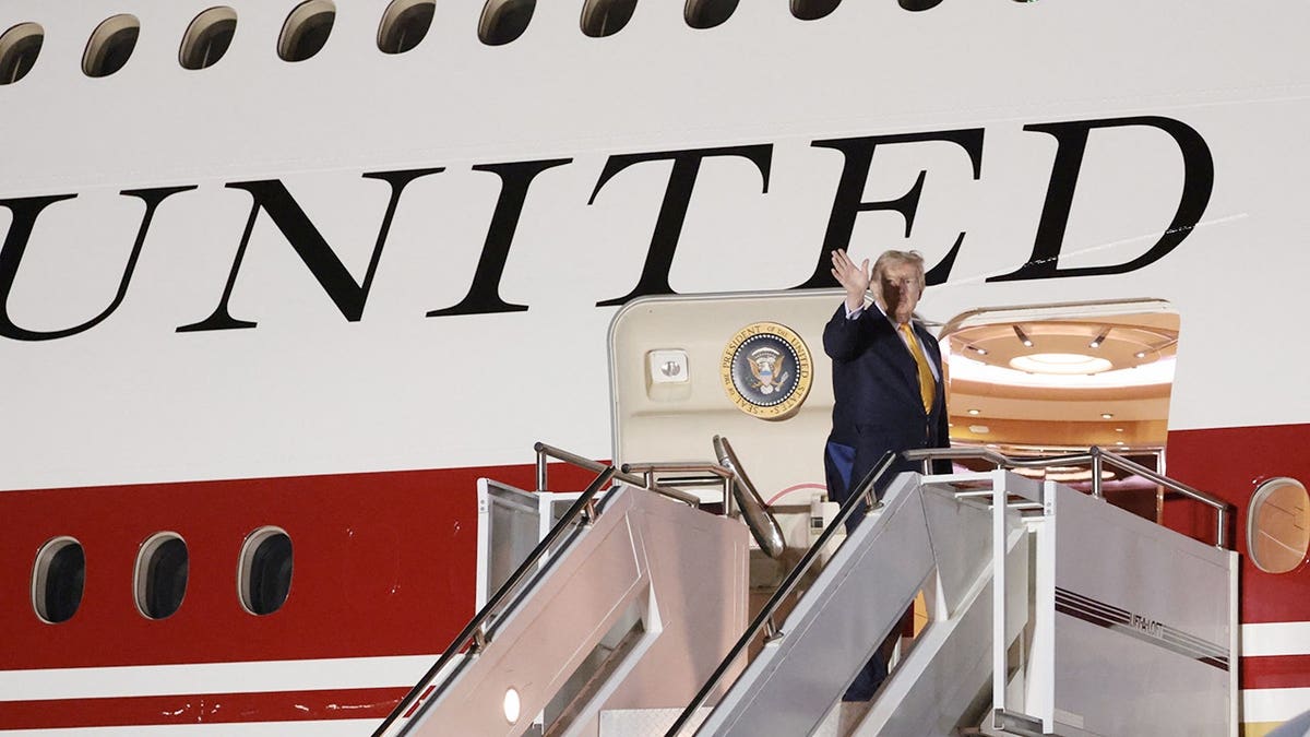 Donald Trump boards Air Force One at RAF Mildenhall.