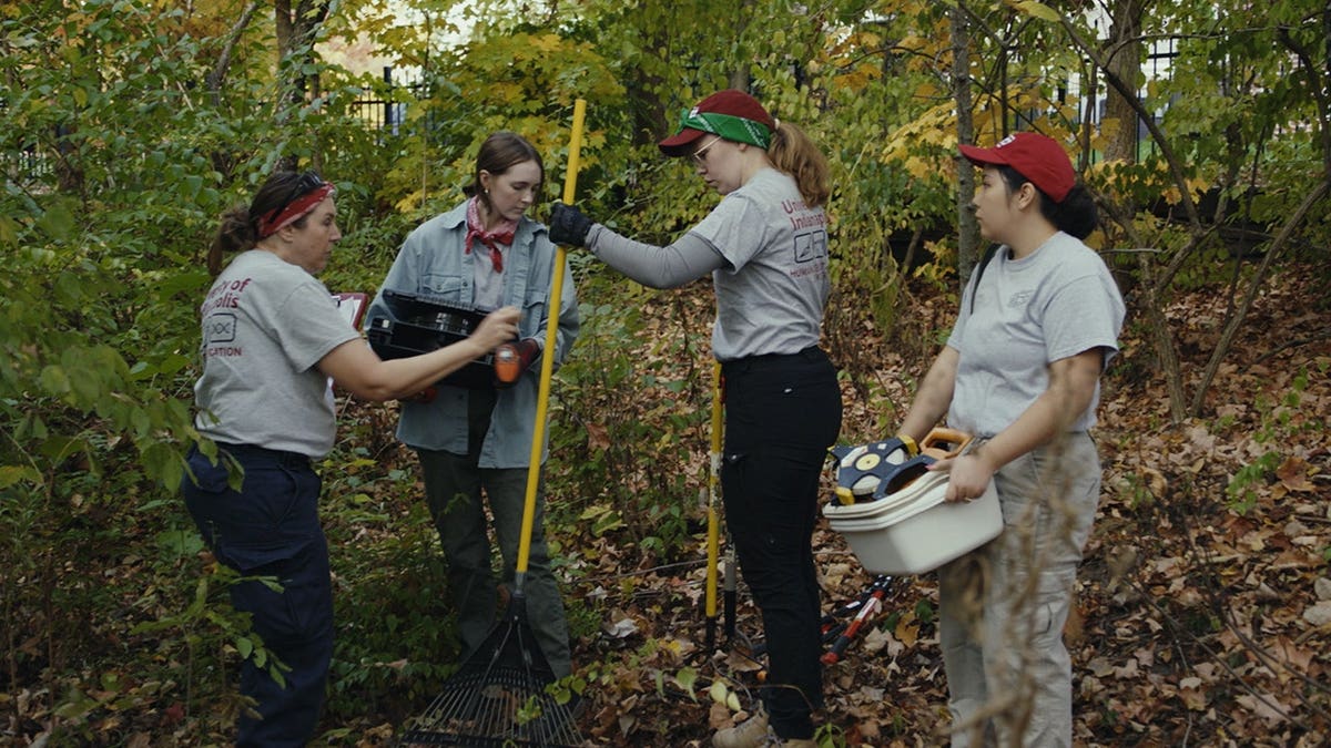 People digging at Fox Hollow Farm during an investigation.