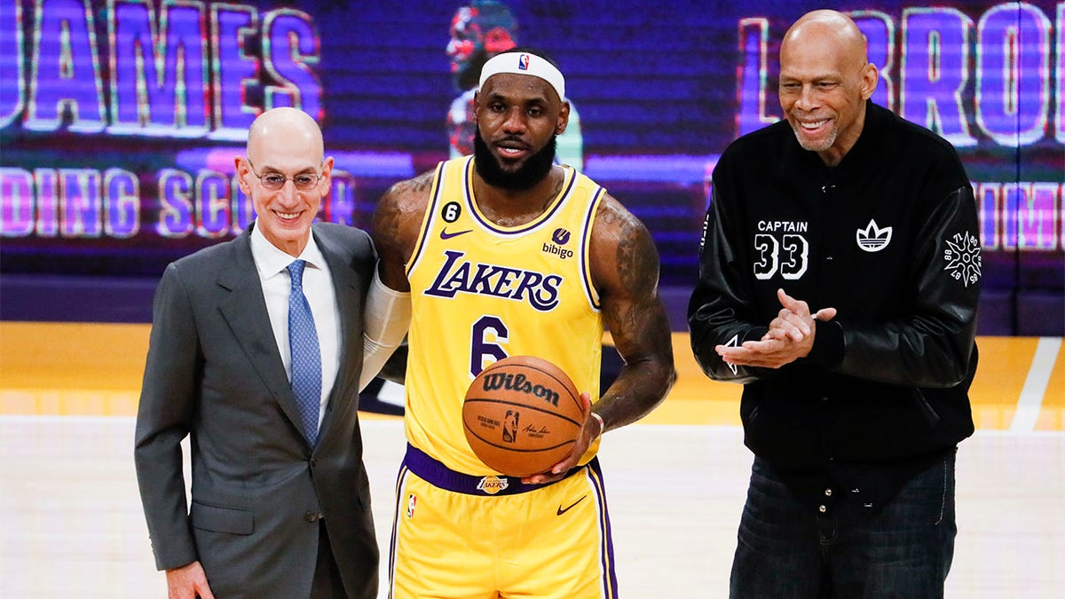 LeBron James takes a picture after becoming the NBA's all-time leading scorer