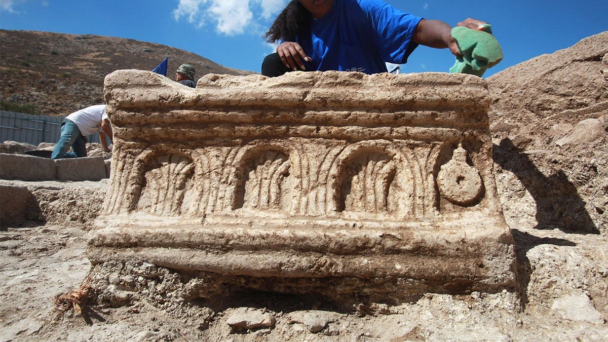 Archaeologist excavating ancient temple in Israel
