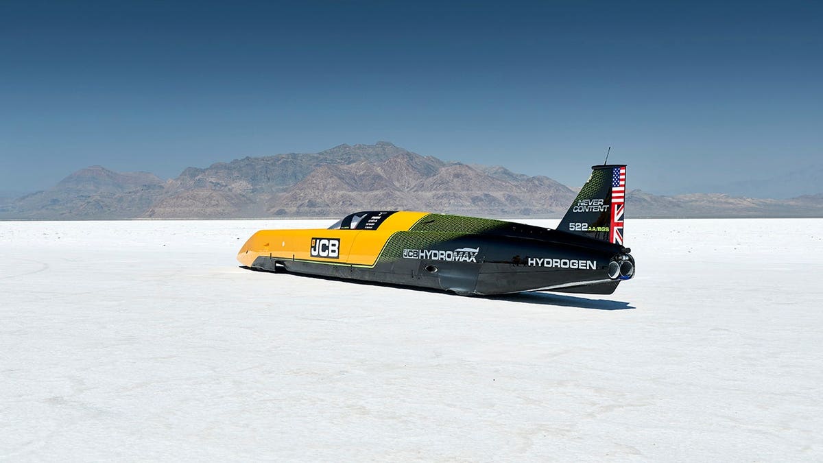 Car sits on salt flats.
