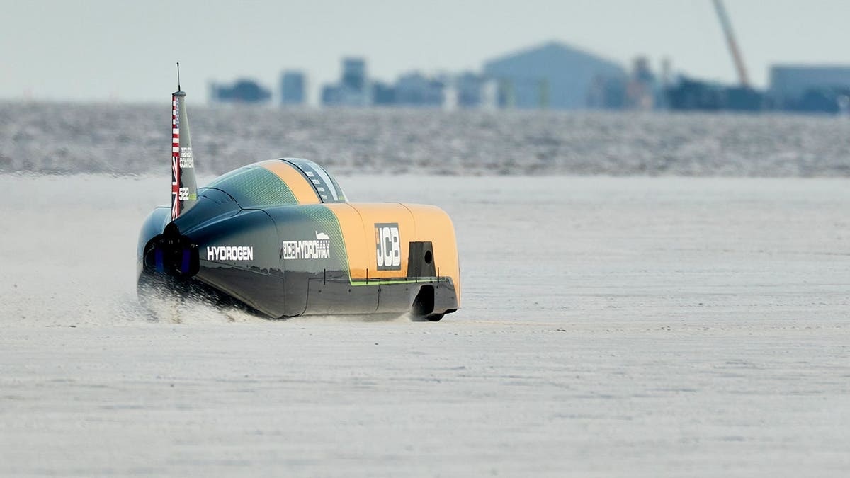 The car moves on salt flats.