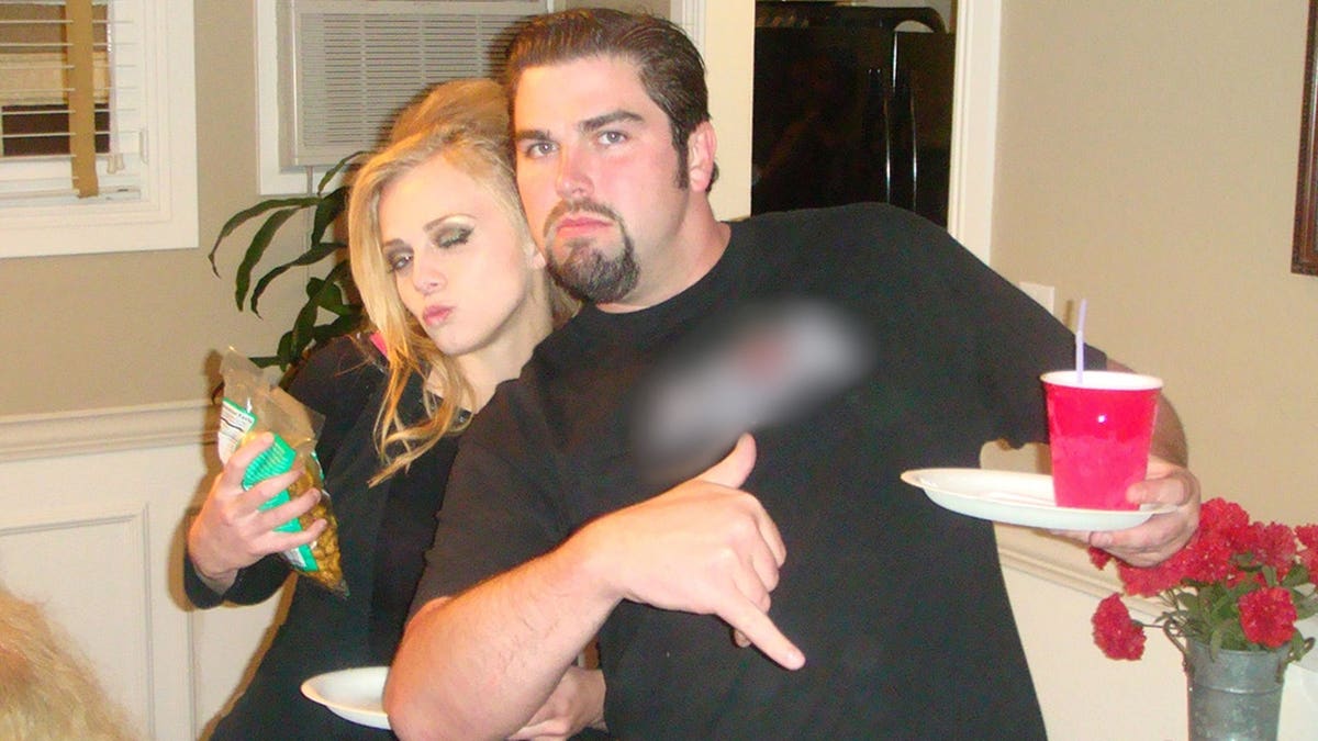 Rachel Buffett taking a silly picture with her then-fiance Daniel Wozniak.
