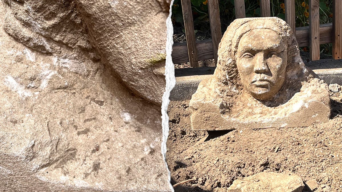 Close-up detail on mysterious statue, view of statue in ground