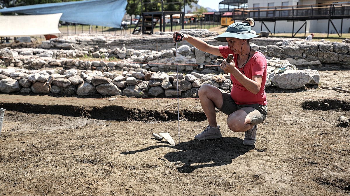 Close-up view of female archaeologist working