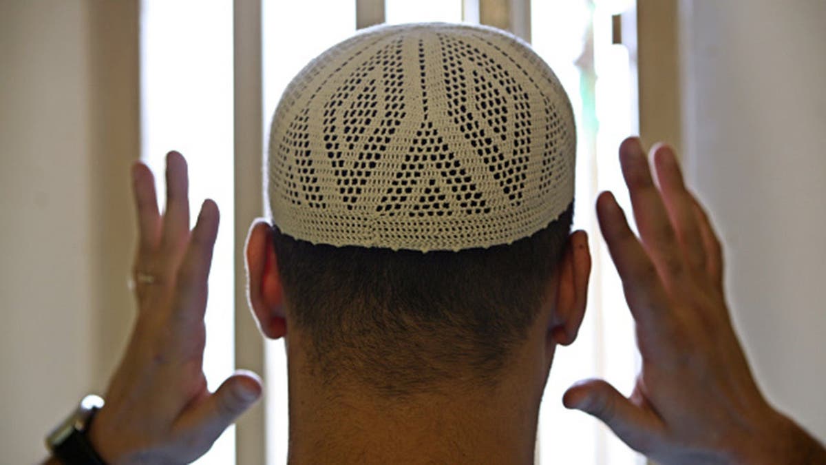 Muslim prisoner praying.