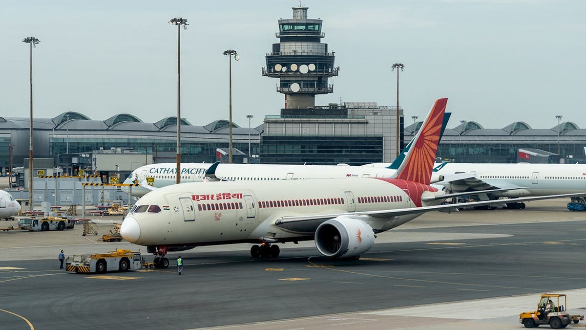 Air India Boeing 787-8 Dreamliner aircraft at Hong Kong International Airport.