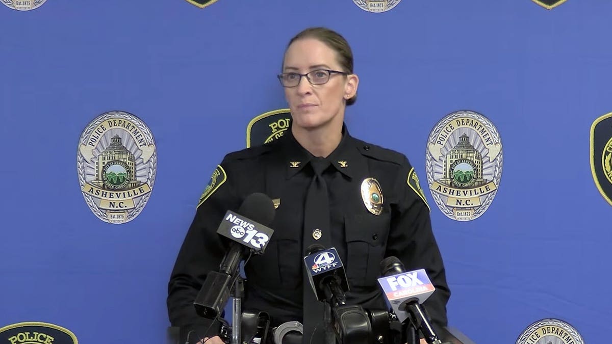 Interim Asheville Police Chief Jackie Stepp speaks at a podium during a briefing on Asheville’s July 19 downtown shooting.